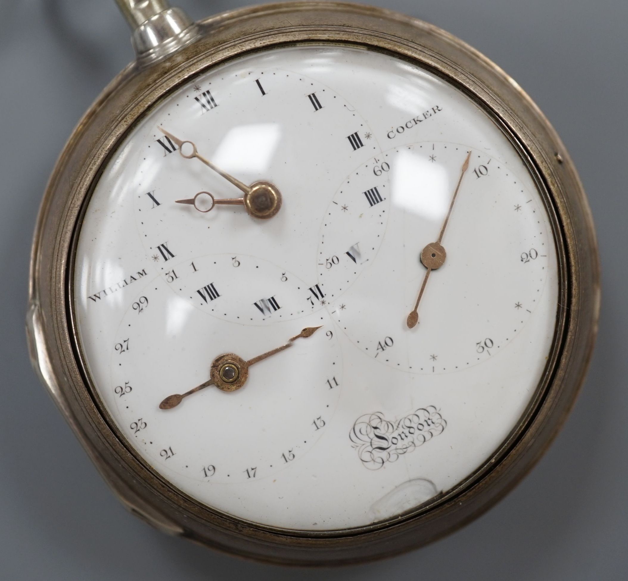 A George III silver pair case keywind pocket watch, by John Williams, Shoreditch, with unusual triple dial, retailed by William Crocker, case diameter, 48mm, the signed movement with diamond set cock.